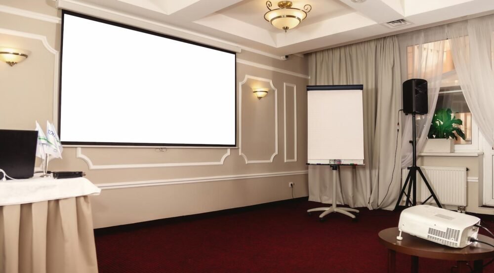 mock-up-screen-display-on-light-wall-in-conference-2026-01-08-23-12-49-utc